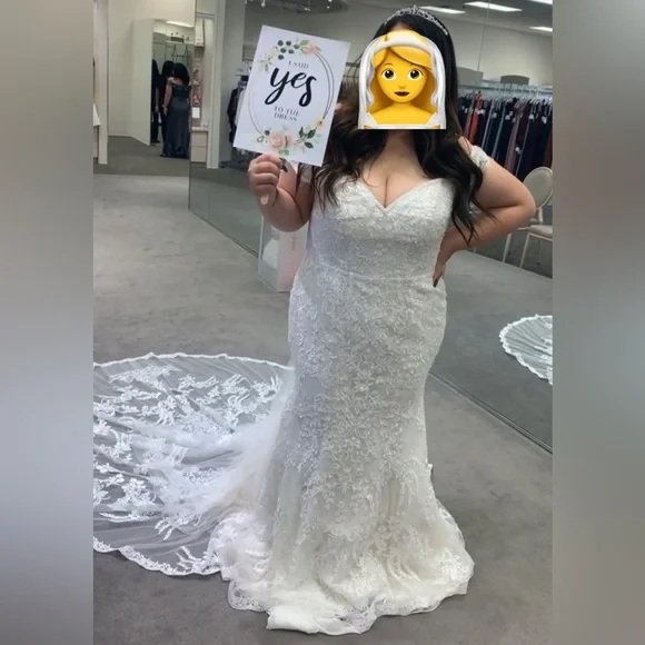 Oleg Cassini off-the-shoulder beaded lace wedding dress. $750. Originally $1400 Oleg Cassini off-the-shoulder beaded lace wedding dress. $750. Originally $1400